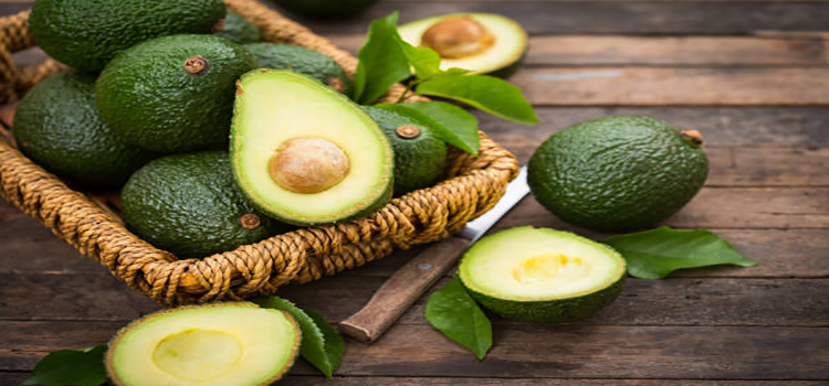 fresh organic avocado on the wooden table