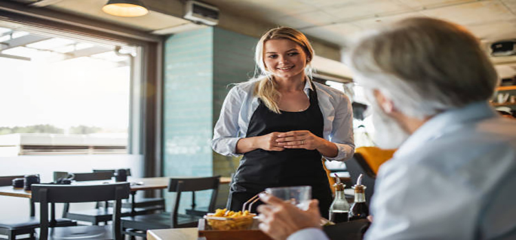 man talking to a restaurant staff