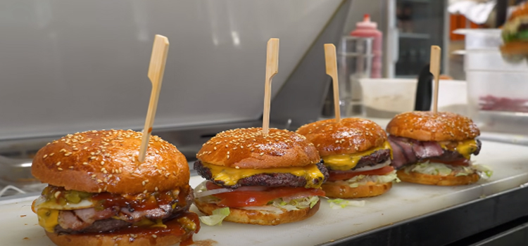 4 burgers on a kitchen restaurant