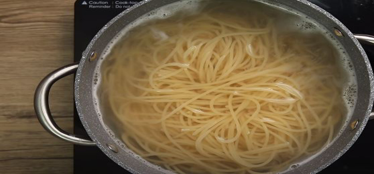 boiling pasta on a pot