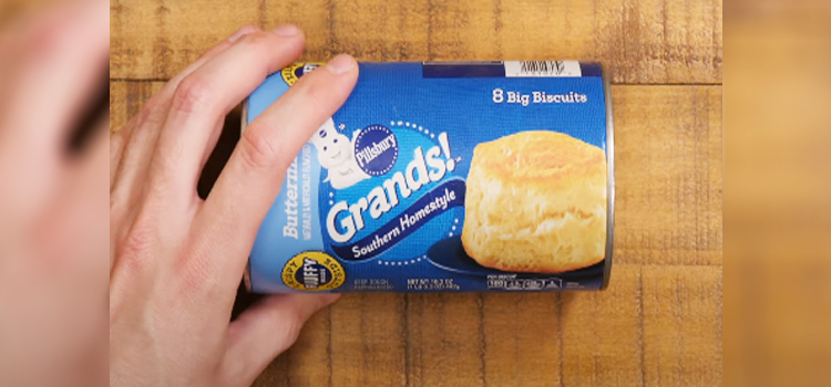 hand holding Pillsbury Biscuits