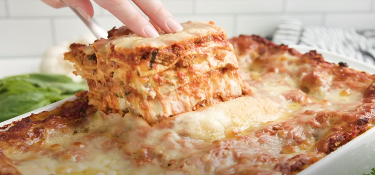 lasagna in a white glass baking tray