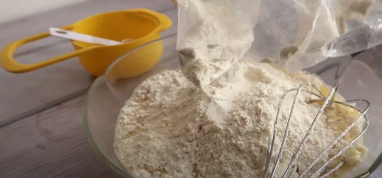 pouring pancake mix on a glass bowl