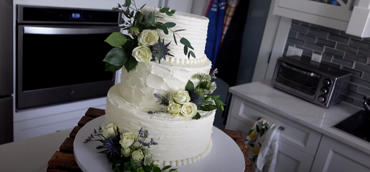 white wedding cake with flower