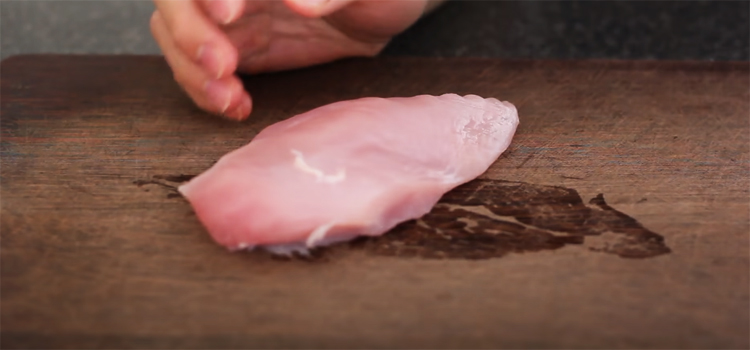 chicken breast on a wooden board