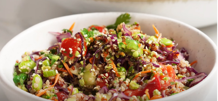 close up shot of quinoa salad on a white bowl