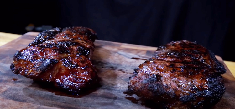 grilled steak on a wooden board