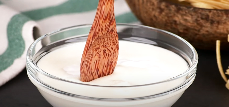 mixing half and half cream on a glass bowl