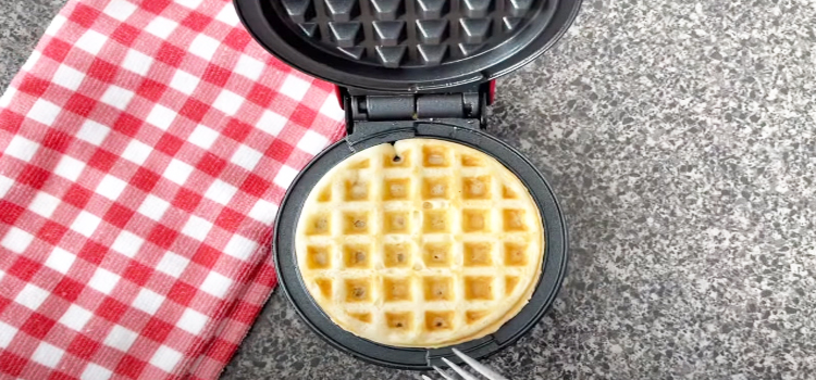 pancake mix on a waffle maker