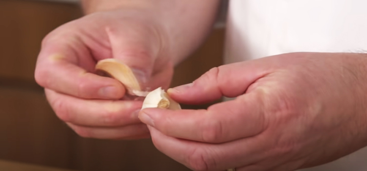 peeling a garlic