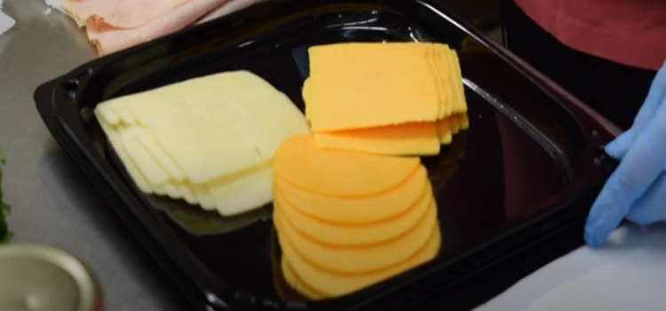 slice cheese on a tray