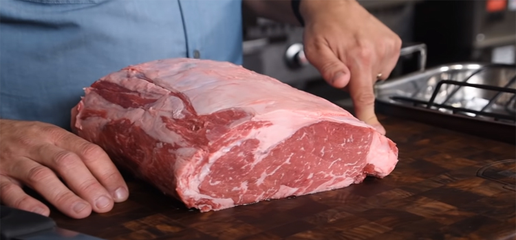 Prime rib on a wooden board