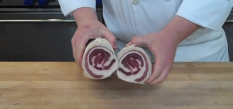 chef holding pancetta