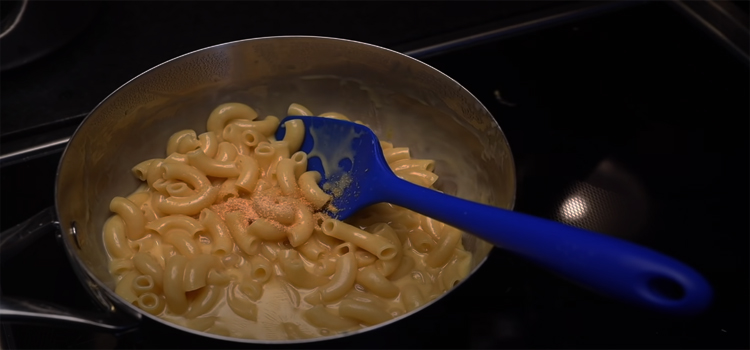 cooking mac and cheese on a stove top