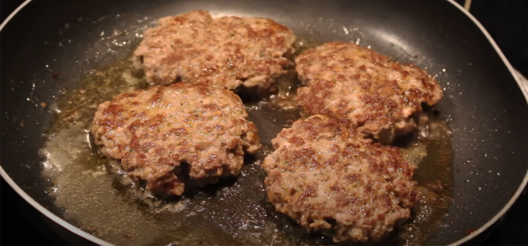 frying homemade beef burger patties