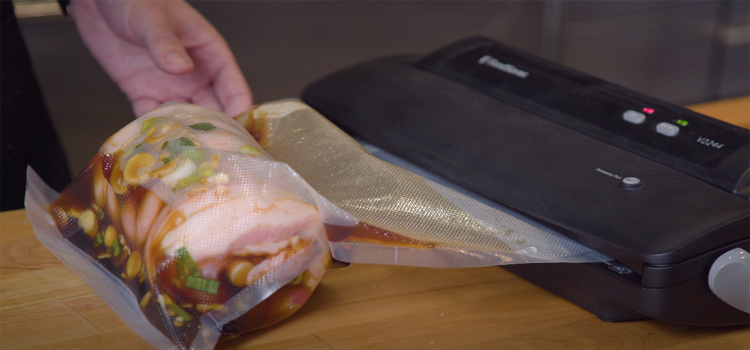 vacuum sealing a marinated meat