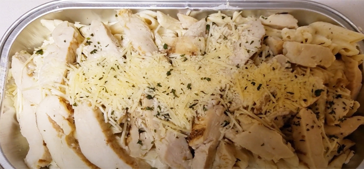 Close up Shot of Costco Chicken Alfredo in an Aluminum Foil Pan