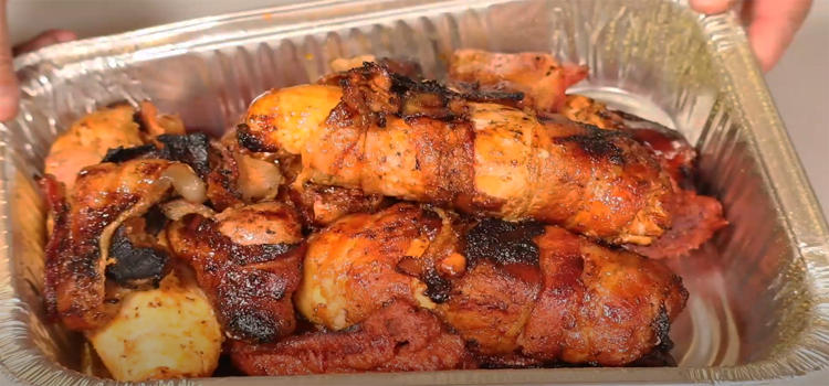 Grilled Bacon Wrapped Chicken in an aluminum foil pan