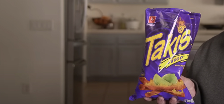 Hand Holding Takis