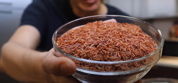 Man Holding Bowl of Uncooked Brown Rice