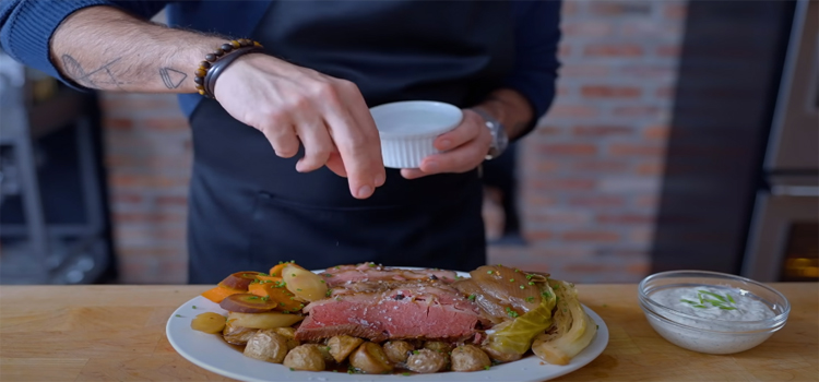 garnishing corned beef on a plate