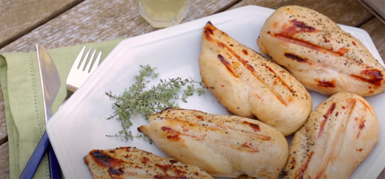 grilled chicken on a  white plate