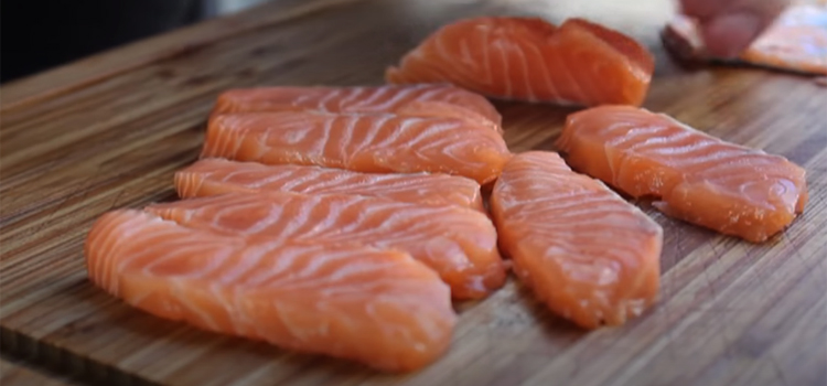 raw salmon on a wooden board