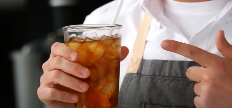 Man Holding Glass of Iced Tea