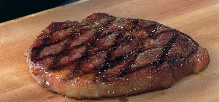 grilled wagyu beef on a wooden board