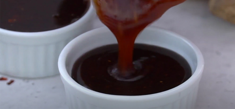 Pouring General Tso Sauce on a Bowl