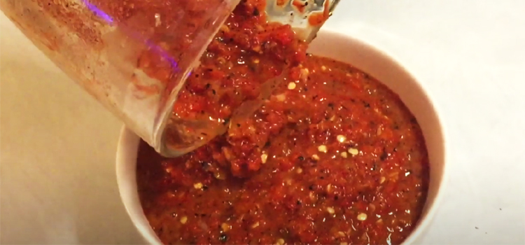 Pouring Jalapeno Salsa on a Bowl