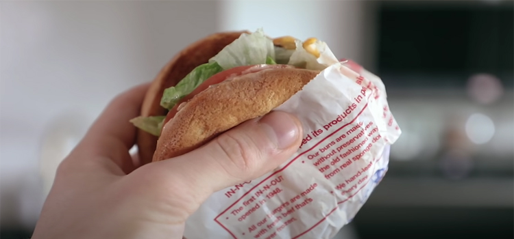 Hand Holding In-N-Out Burgers