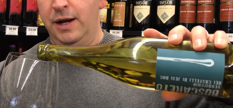 Pouring Bottle of Buscareto Verdicchio on a Glass