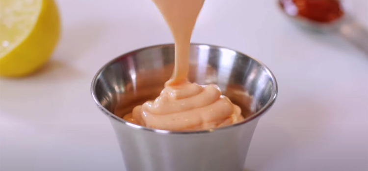 Pouring Homemade Sriracha Mayo