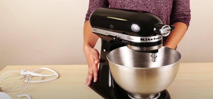 Woman Holding KitchenAid Classic Stand Mixer