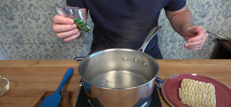 person cooking ramen