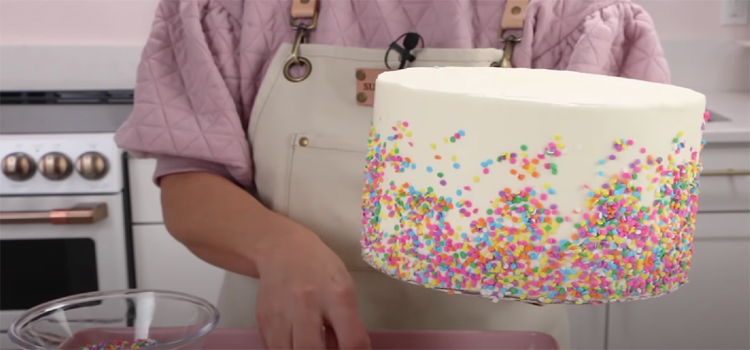 person making funfetti cake