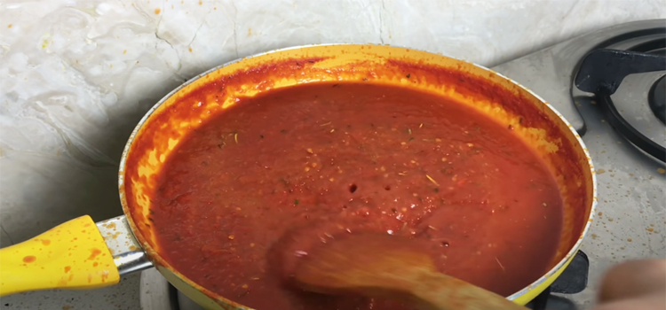 pizza sauce on a pan