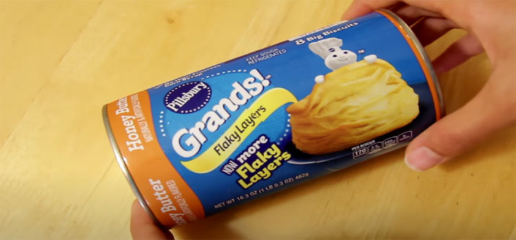 Hand Holding Canned Pillsbury Biscuits