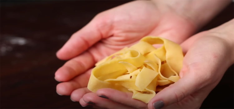 Hand Holding Homemade Pasta