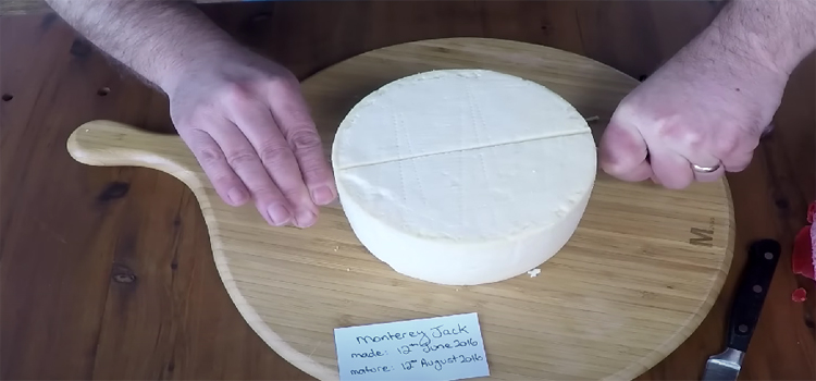 Man Slicing Monterey Jack Cheese