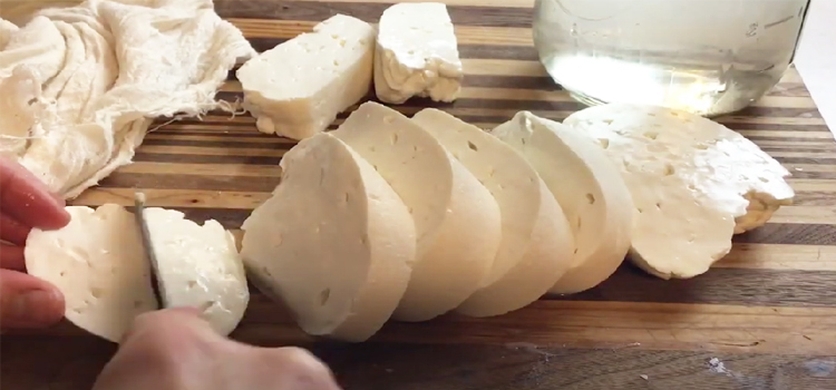 Person Slicing Homemade Feta Cheese