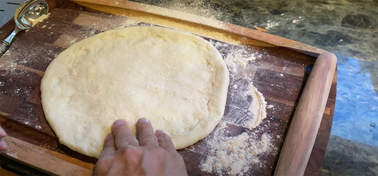 Pizza Dough on a Wooden Board