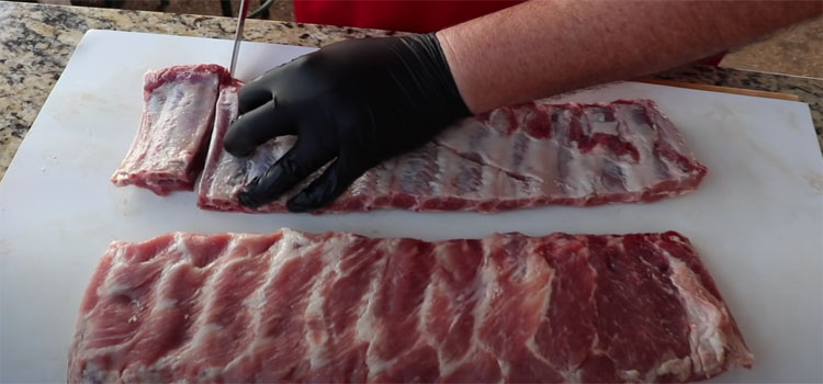 Man Slicing Ribs