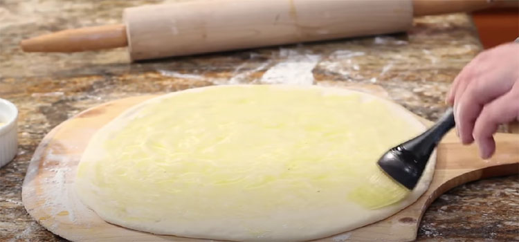 Brushing Oil on a Pizza Dough