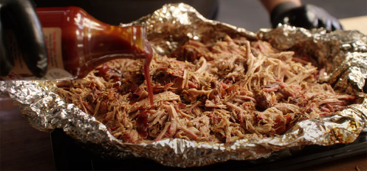 Pouring Sauce on a Pulled Pork