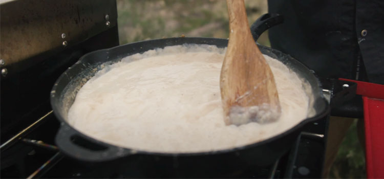 Person Making Country Gravy