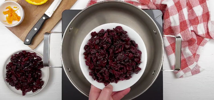 Person Making Cranberry Sauce