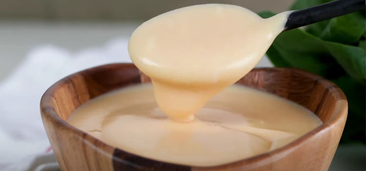 Cheese Gravy on a Wooden Bowl