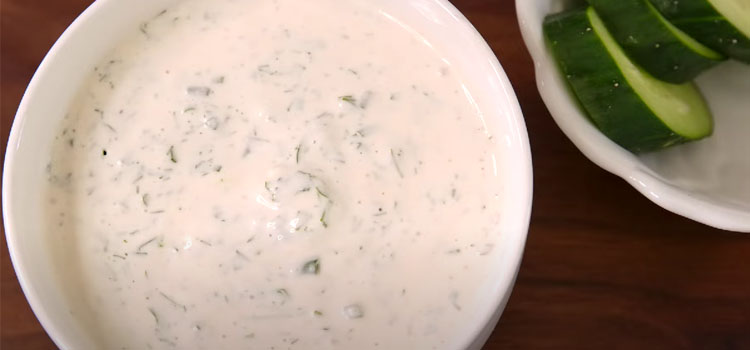 Bowl of Ranch Dressing and a Cucumber